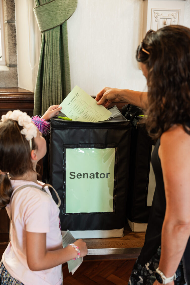 Mother and child casting ballot